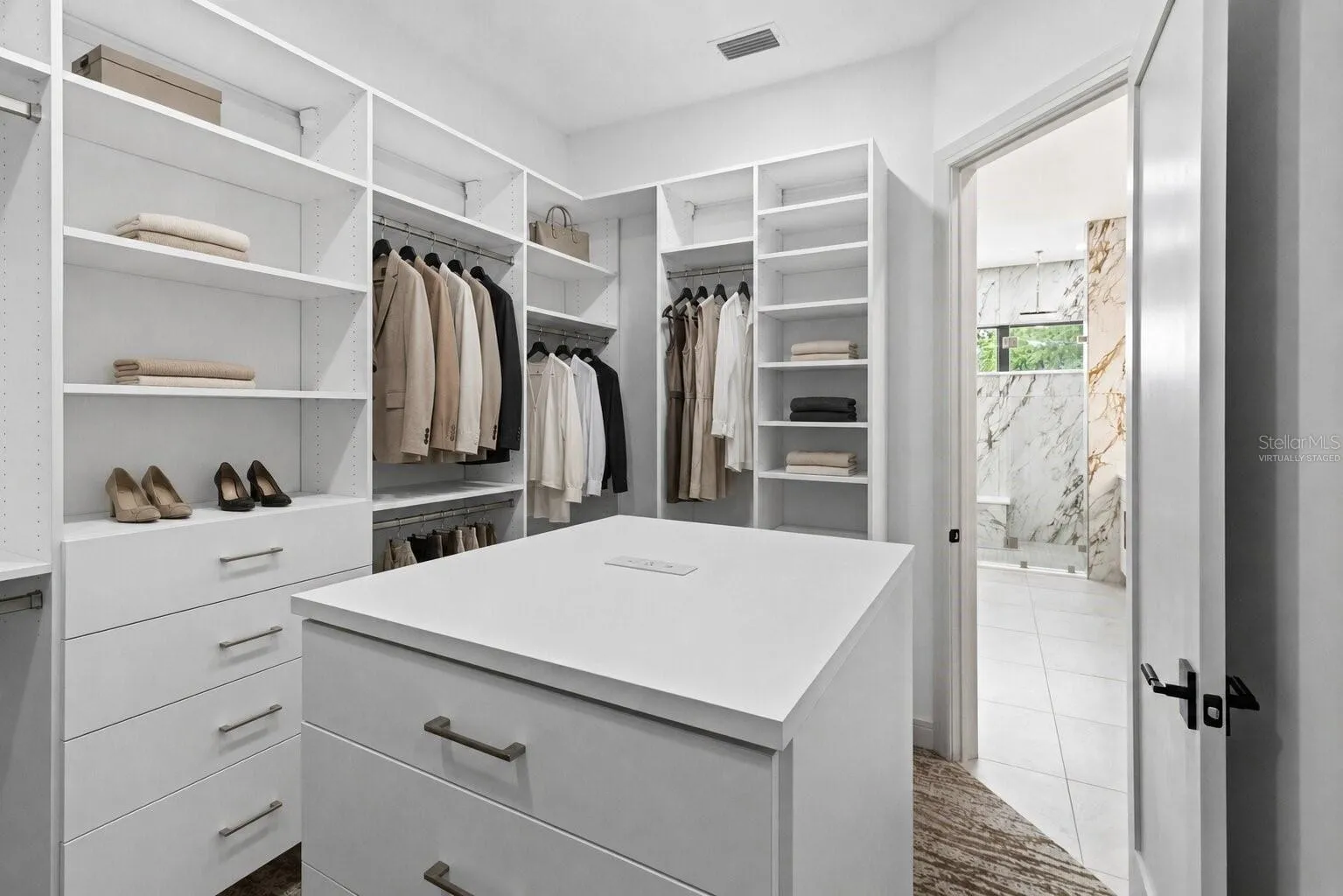 Virtually Staged Image of custom walk-in closet