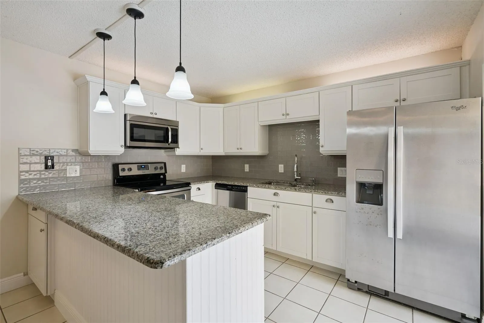Eat-In Kitchen with access to the fenced-in courtyard
