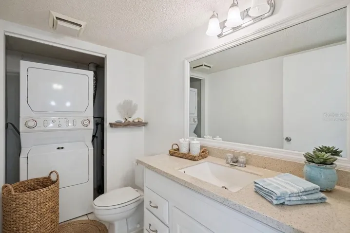 Virtually Staged Half Bathroom on first floor with Washer/Dryer