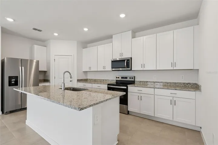 Photos are not of the actual home, but are photos of the builder home with same floorplan