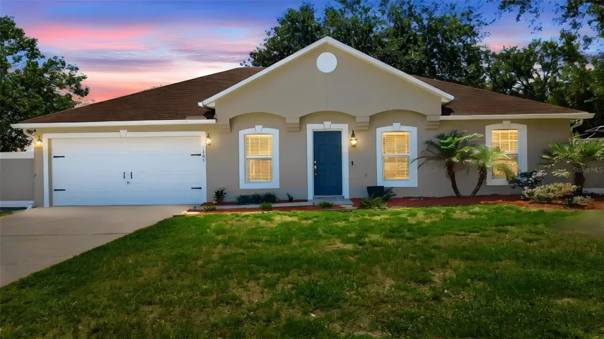 Gorgeous 3/2/2 split floor plan with newer huge screen rear porch on large lot.