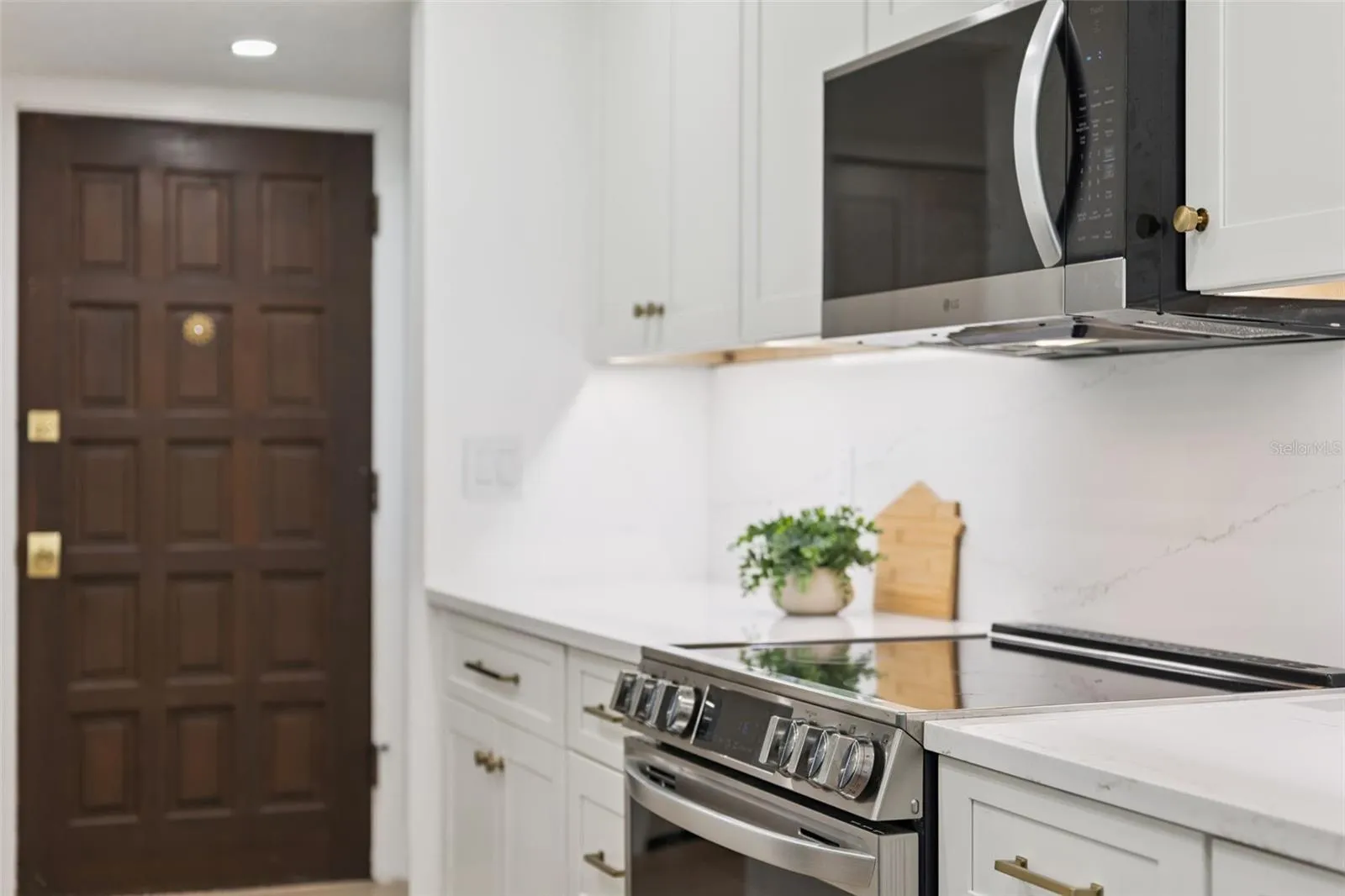 Contrasting cabinetry and All new appliances