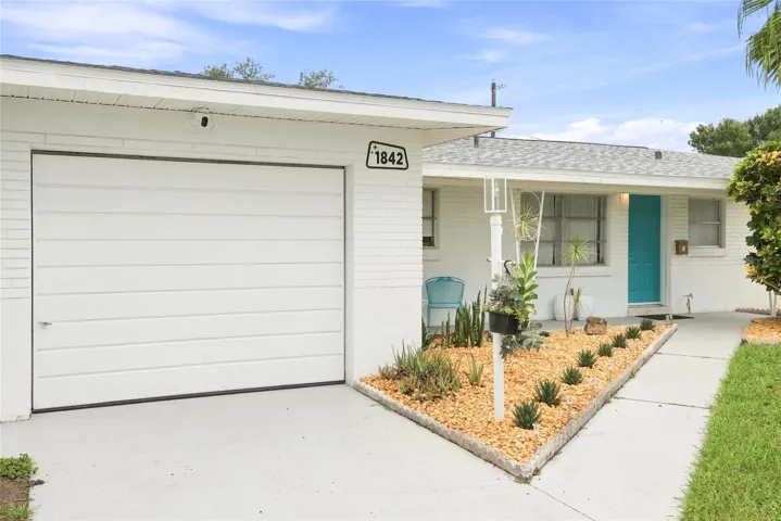 Welcome to an original mid-century home with modern upgrades at 1842 59th Way N!