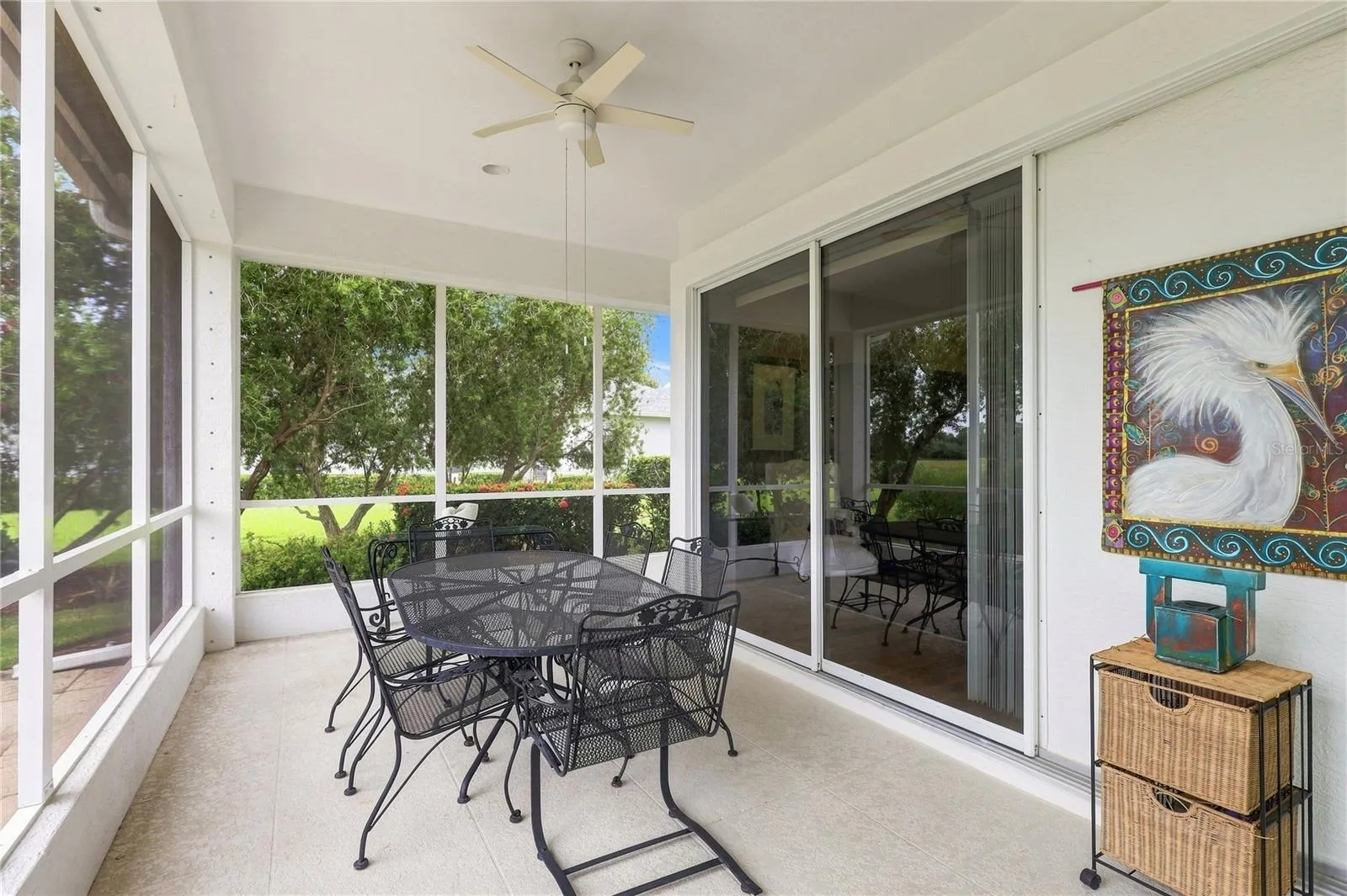 Screened lanai with direct access to the primary bedroom through sliding glass doors