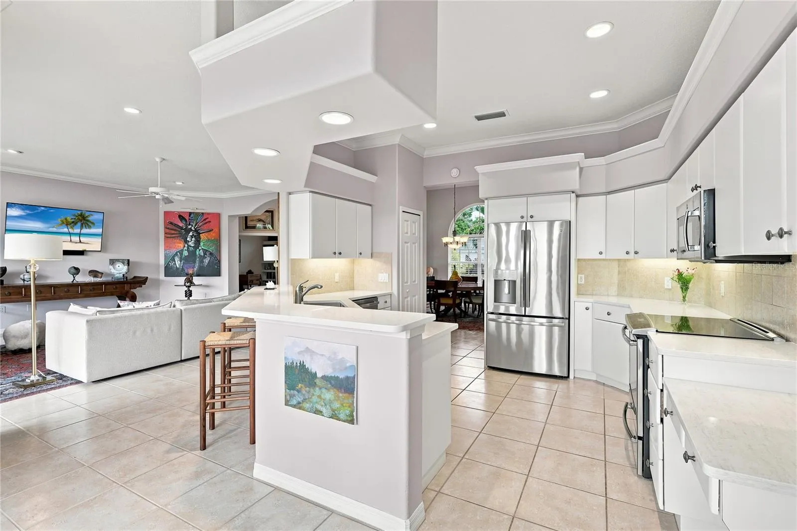 Spacious kitchen with quartz countertops, stainless appliances and an open connection to the Great room