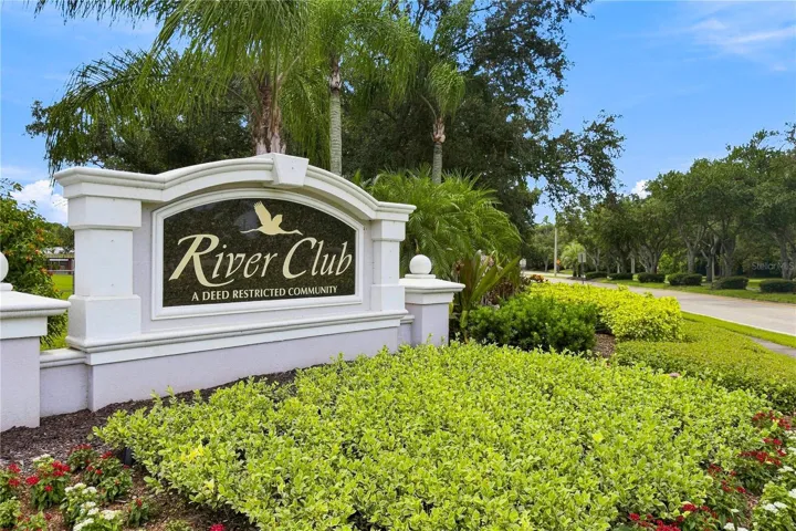 Welcoming entrance to River Club, a beautifully  maintained deed-restricted community with low HOA fees and no CDD fees