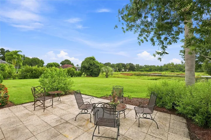 Spacious outdoor patio overlooking the expansive backyard