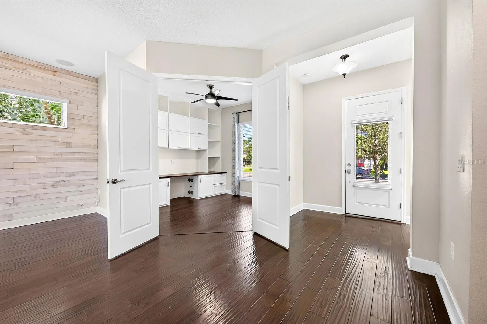 Double doors open to the office/flex space off the foyer.