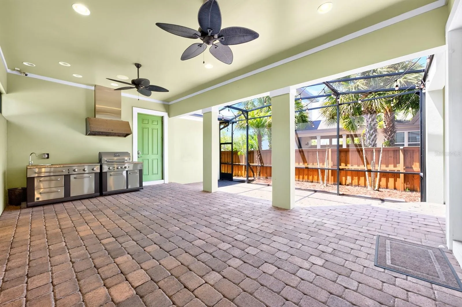 Extended screened lanai, summer kitchen.