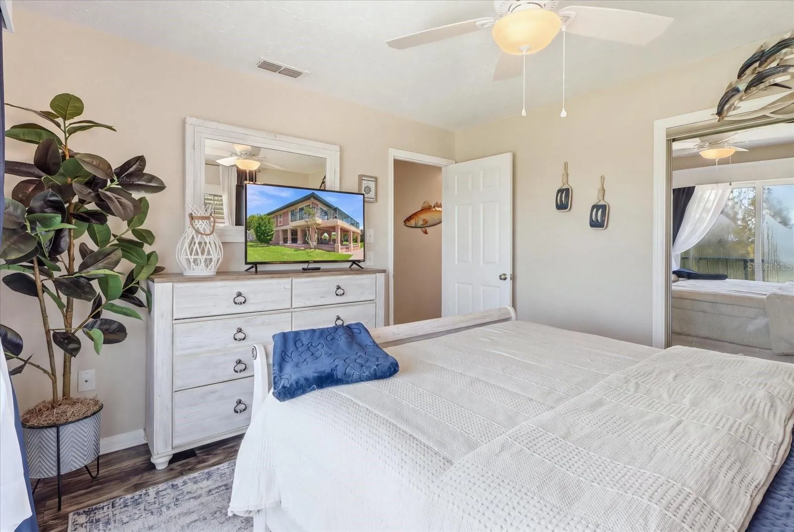 Alternate guest bedroom view showing additional furnishings and storage.
