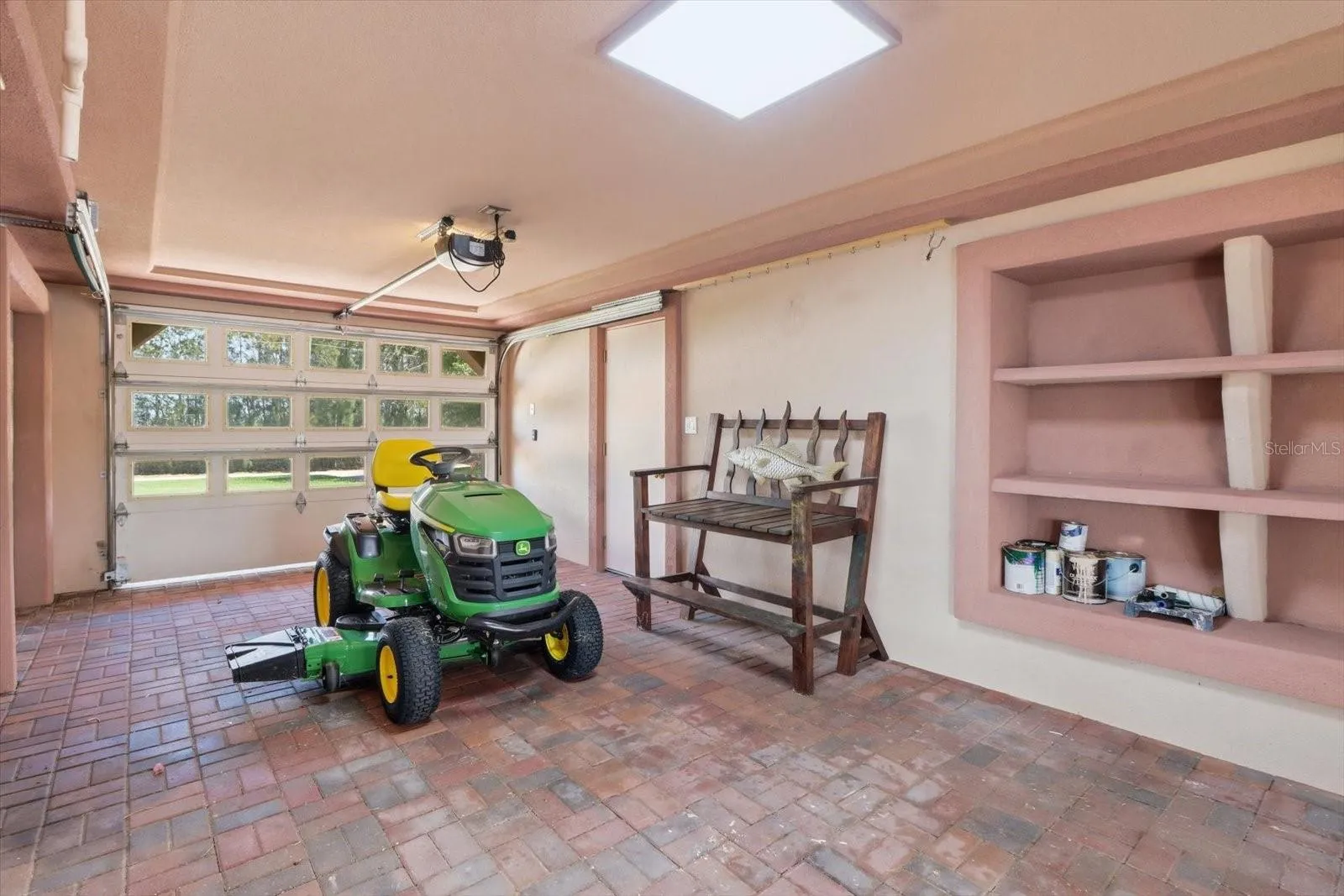 Alternate garage view showing additional storage and direct exterior access.