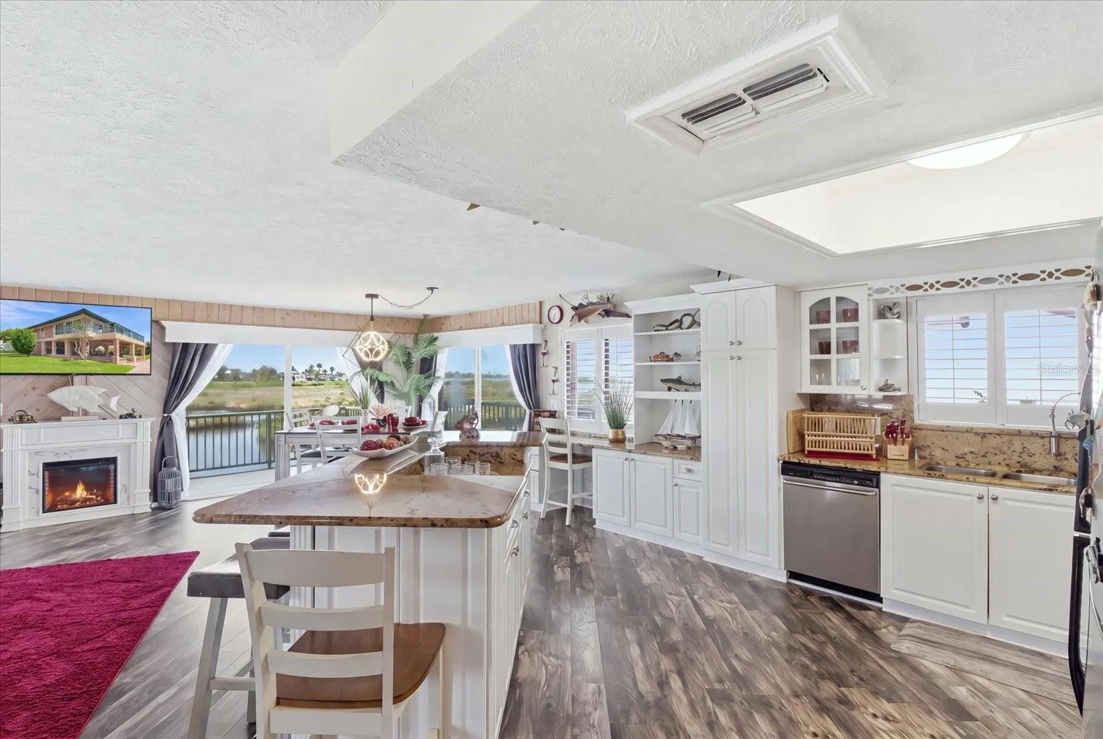 Kitchen and dining area positioned to take advantage of waterfront views.
