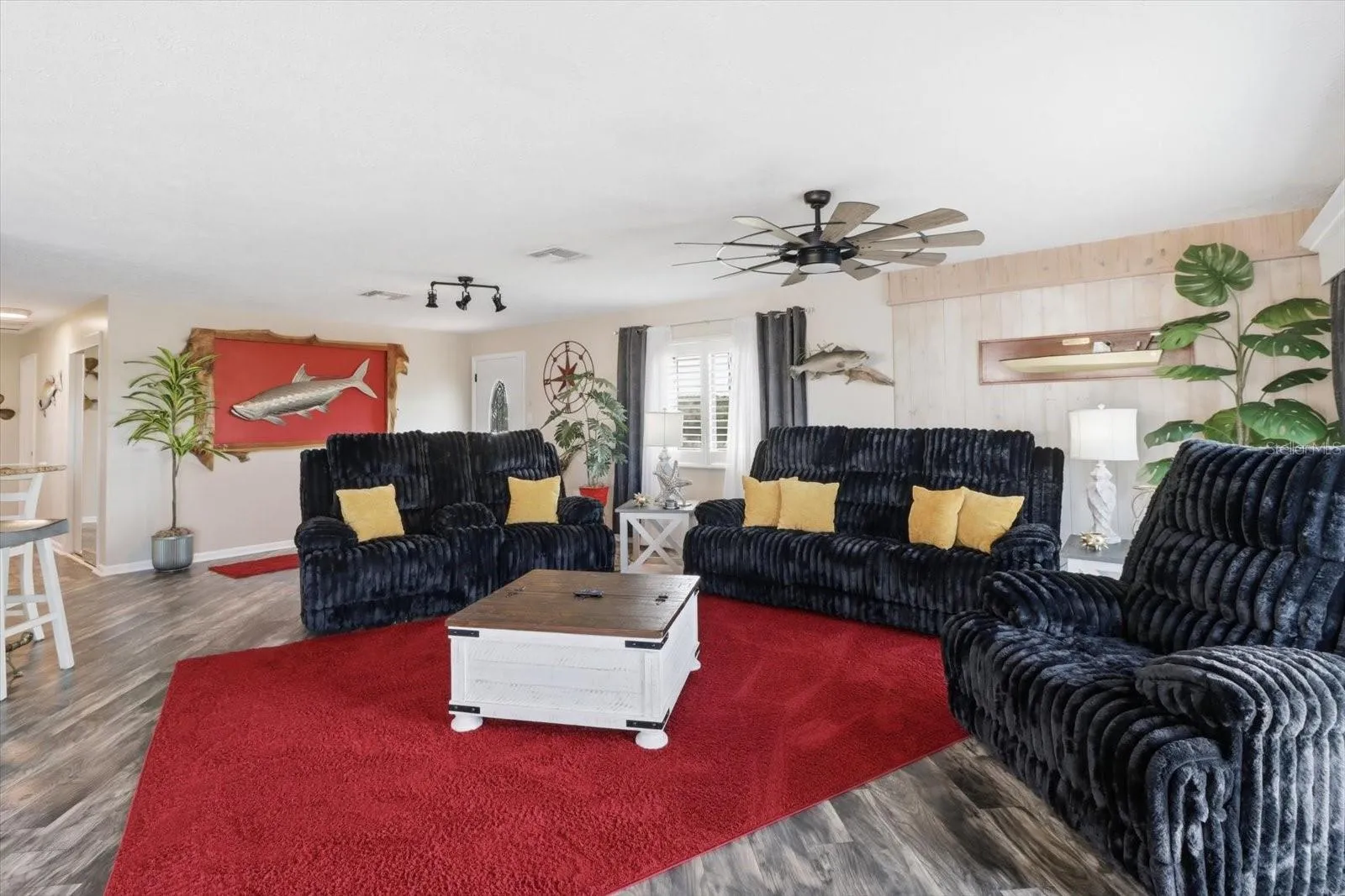 Main living room with open-concept layout and coastal décor.