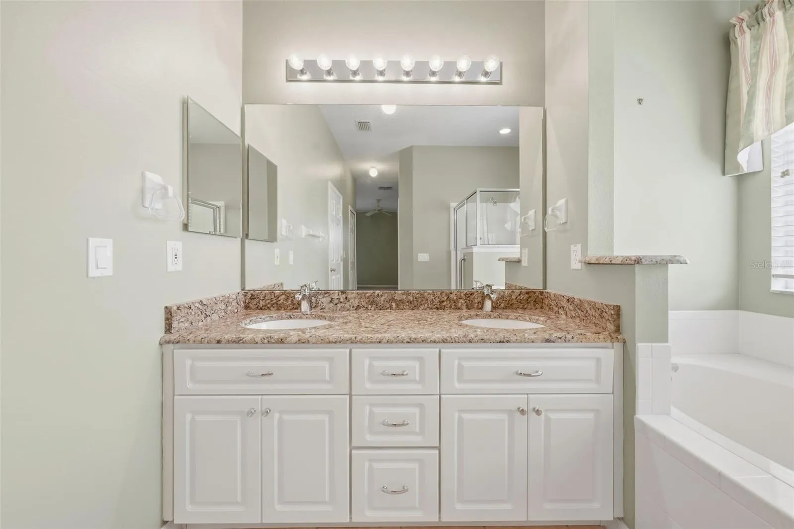 Double sinks and plenty of cabinets.