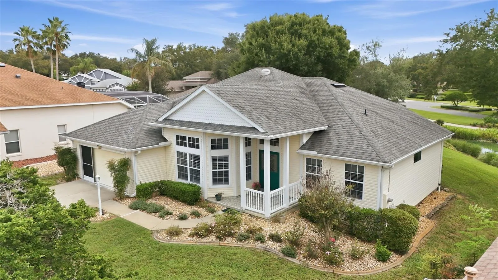 Beautiful curb appeal wigth a welcoming covered entry, distinctive architertural details, mature landscaping, and a spacious homesite!