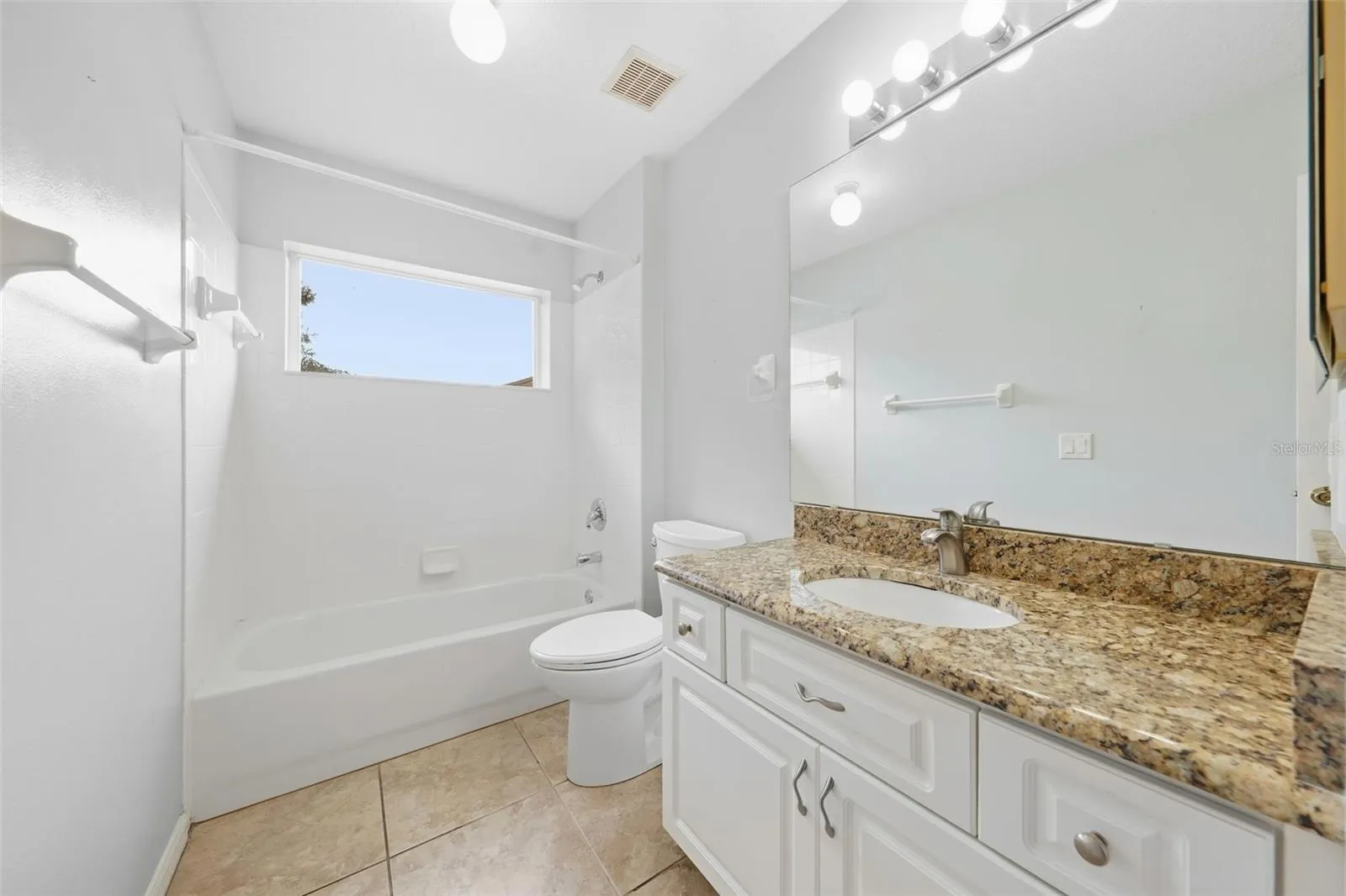 2nd bath....featuring a granite vanity, generous counter space, and convenient walk-in shower.
