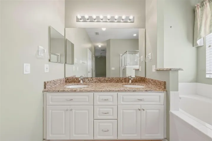 Double sinks and plenty of cabinets.