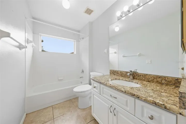 2nd bath....featuring a granite vanity, generous counter space, and convenient walk-in shower.