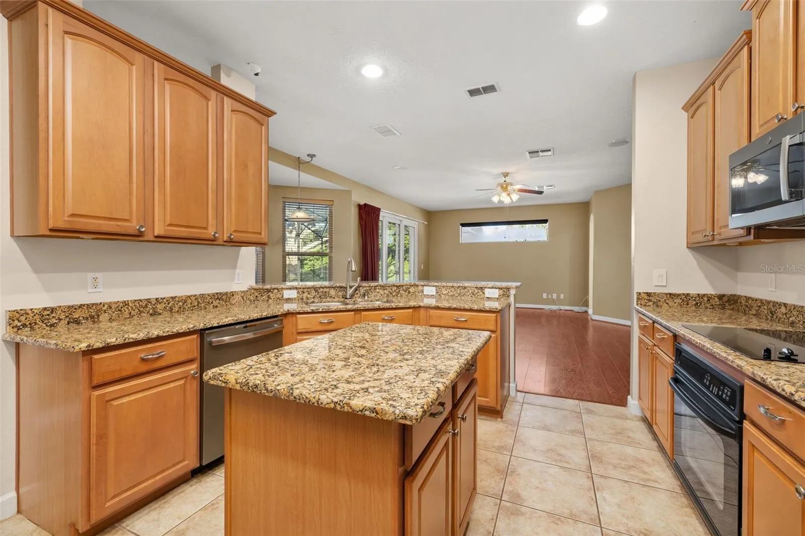Granite countertops, wood cabinets, and stainless steel appliances
