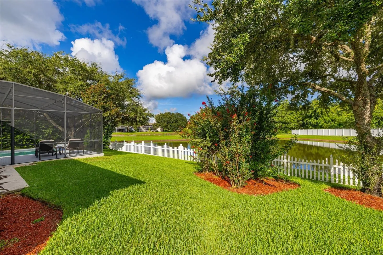 Luscious landscaping and plenty of room for more entertainment and outdoor enjoyment