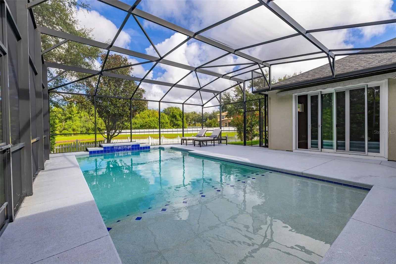 More access to the outdoor living by way of sliding glass doors from the family room