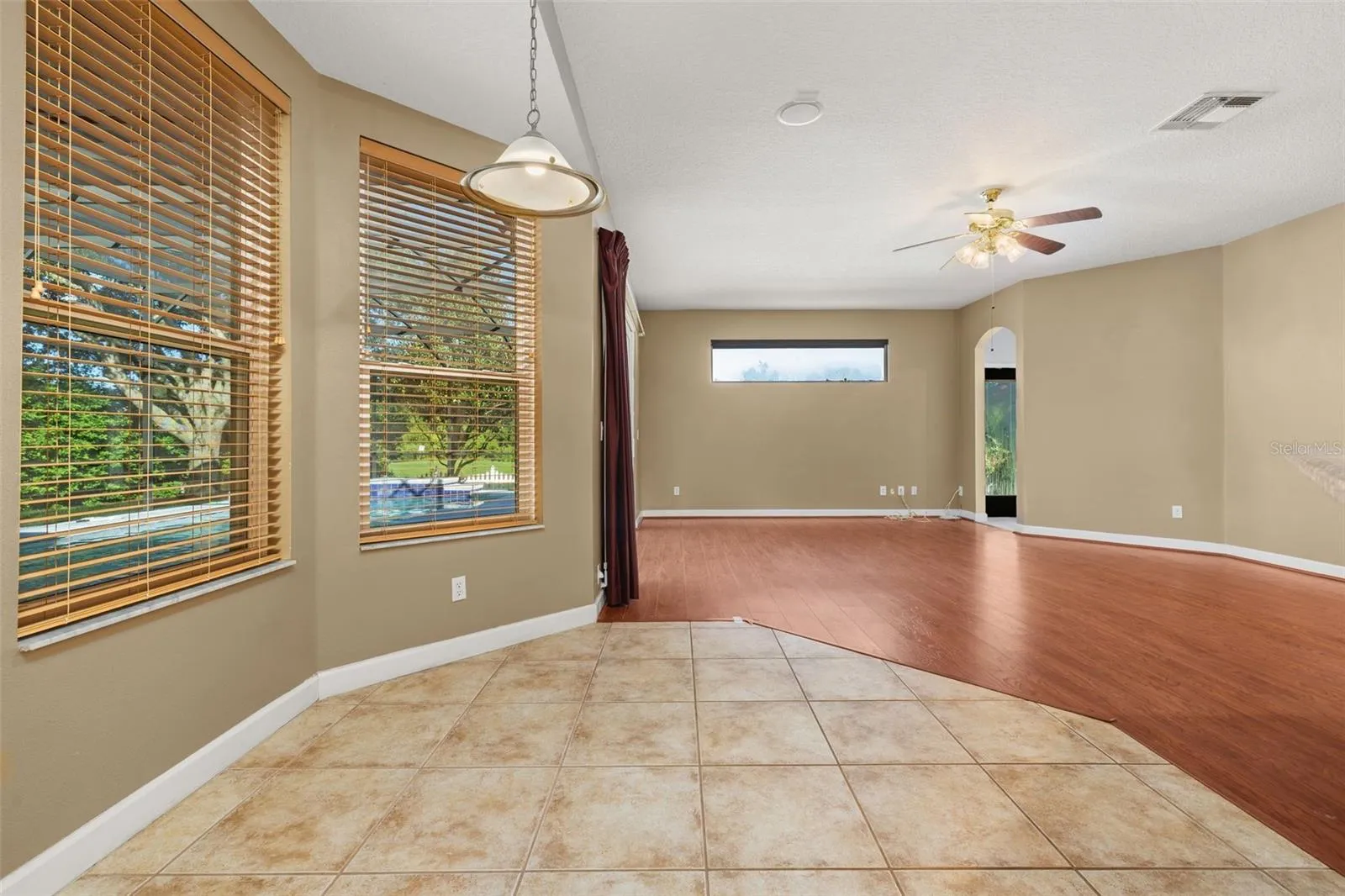 Casual dining space overlooking the pool