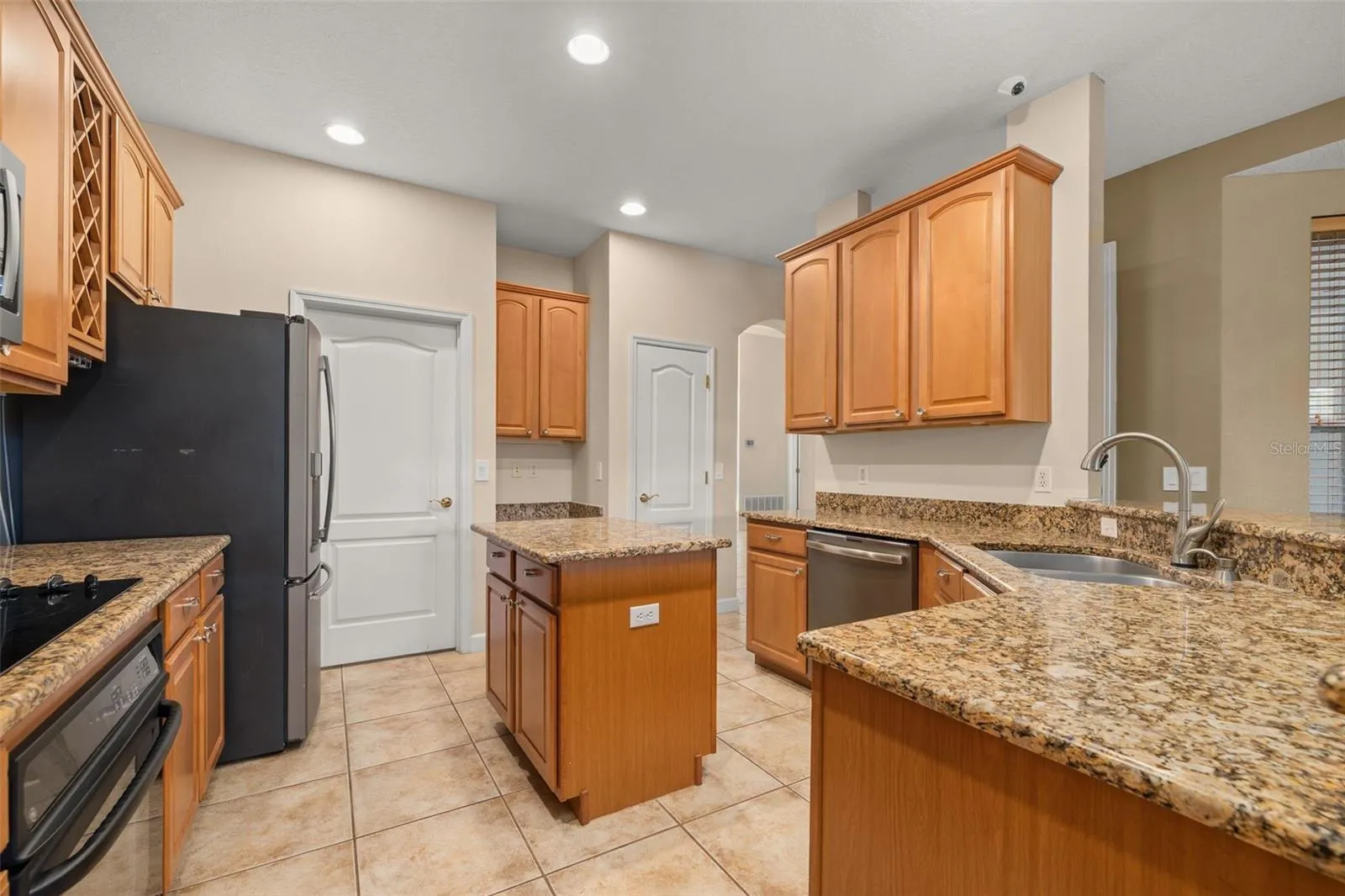 Door to the laundry room and 2-car garage