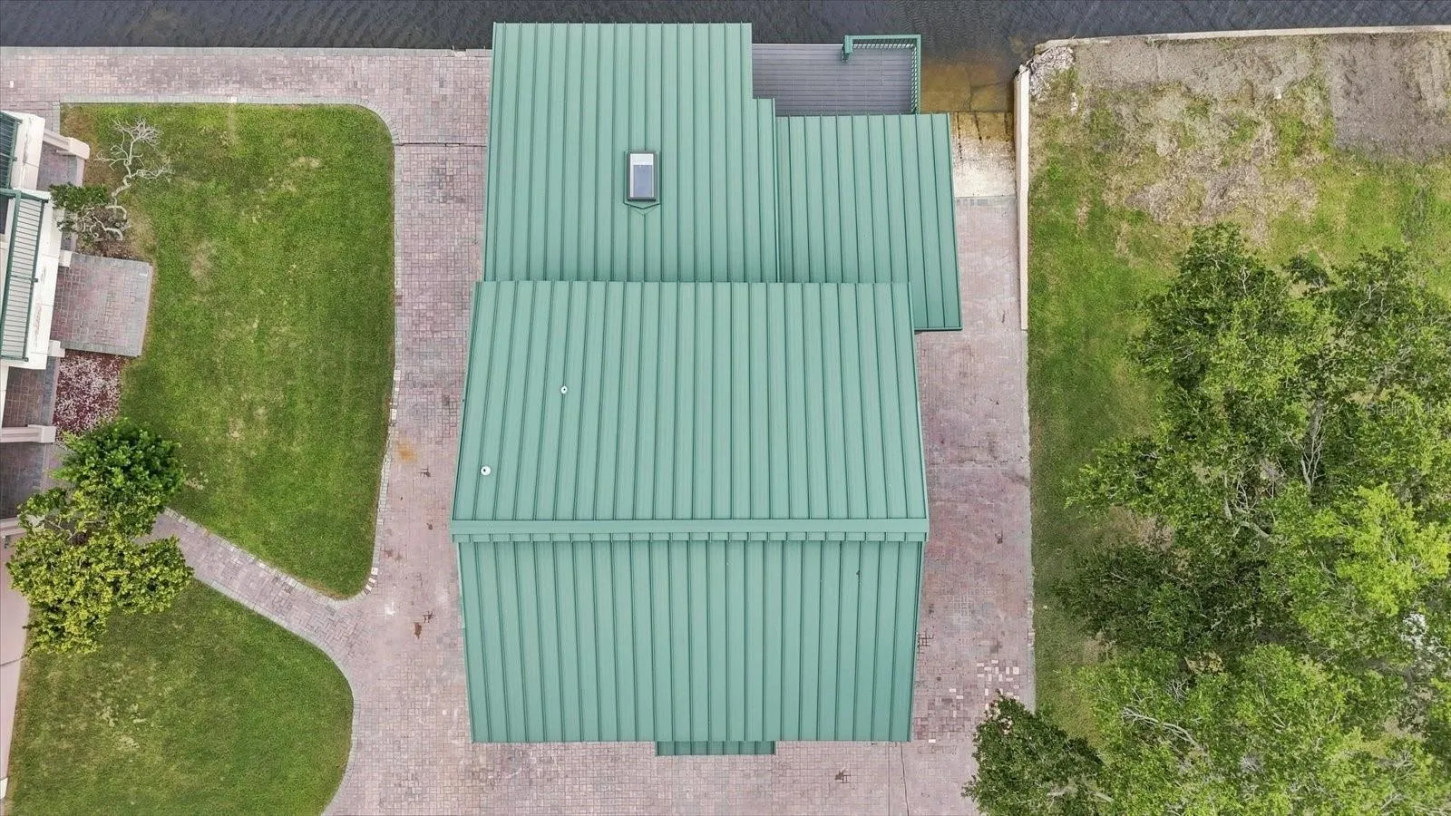 Overhead Aerial – Residence, Metal Roof &amp; Waterfront Site