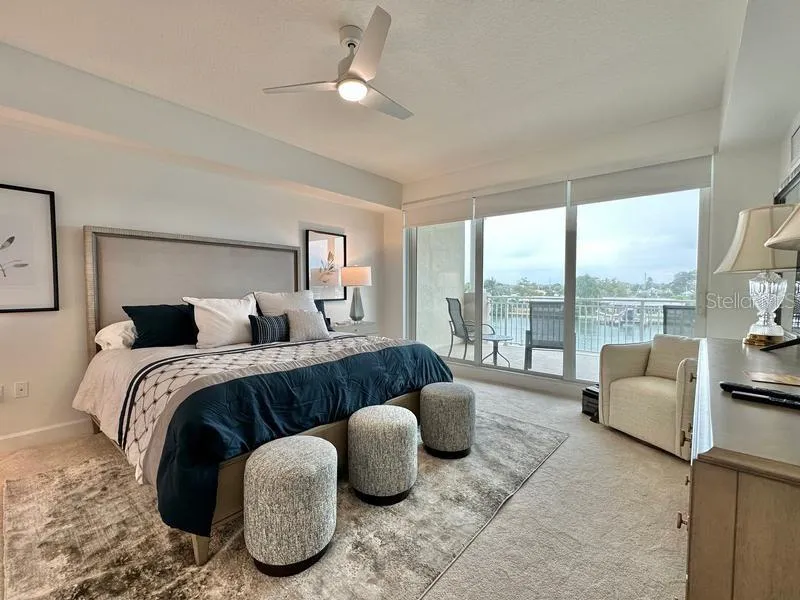 Primary bedroom with balcony access