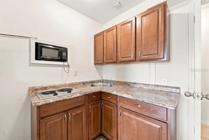 Garage Studio Apartment Kitchenette - AI Enhanced
