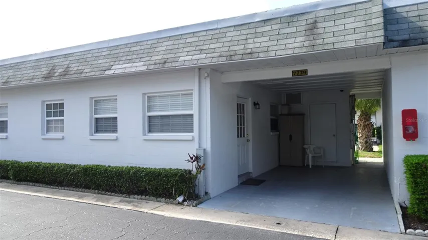 Welcome to 7729. Private carport and laundry room. This is the side door into kitchen.