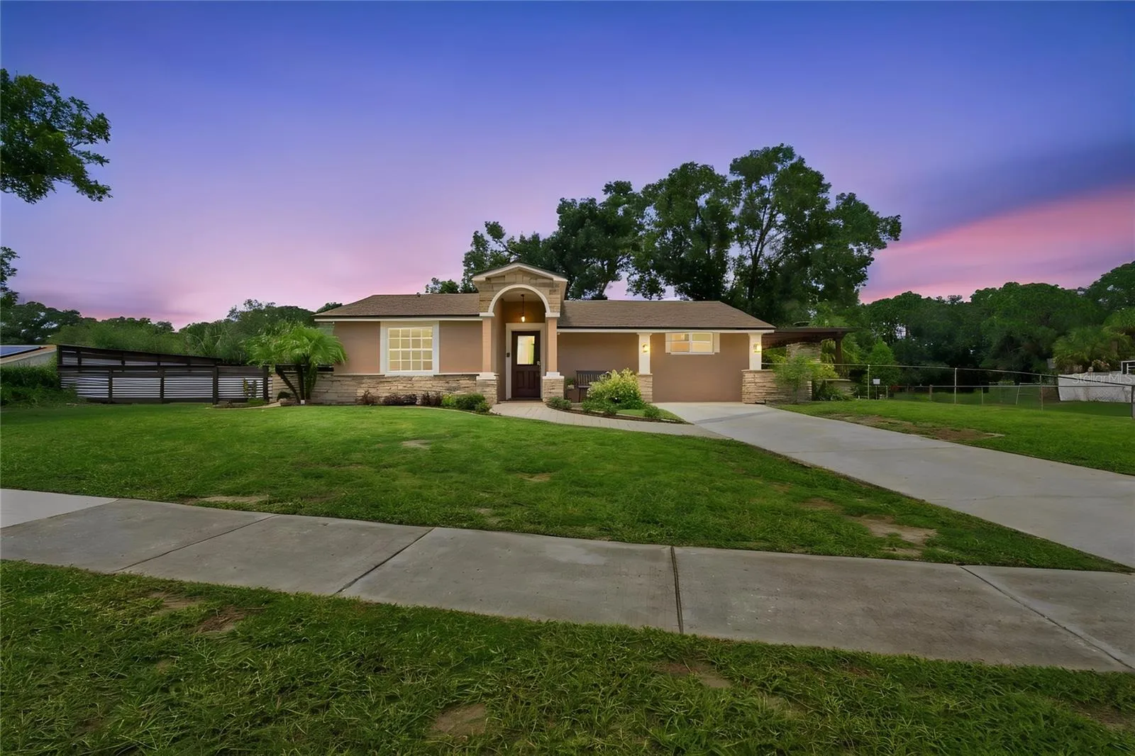 Front View warm color stone decor blends for a cohesive upgrade look, with Portico and Porch, paved walkway to complete the beautiful curb appeal.