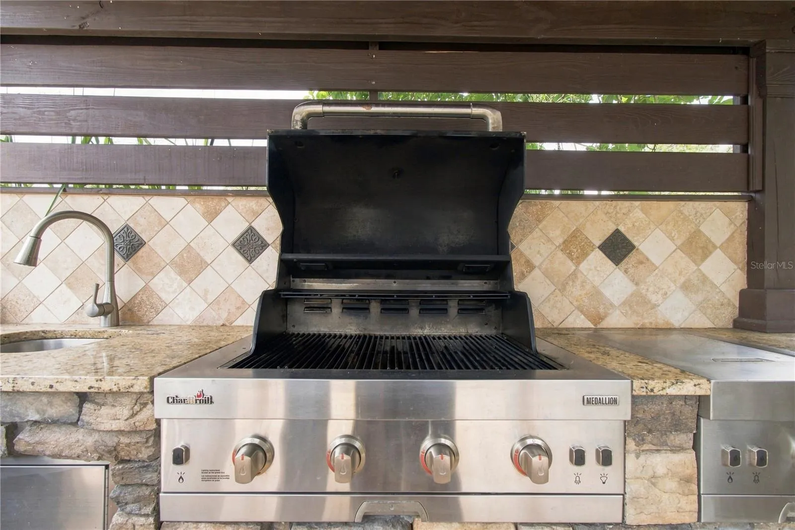 an open-air poolside BBQ cabana