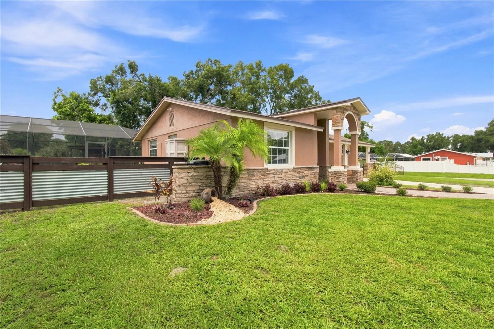 Front View warm color stone decor blends for a cohesive upgrade look, with Portico and Porch, paved walkway to complete the beautiful curb appeal.