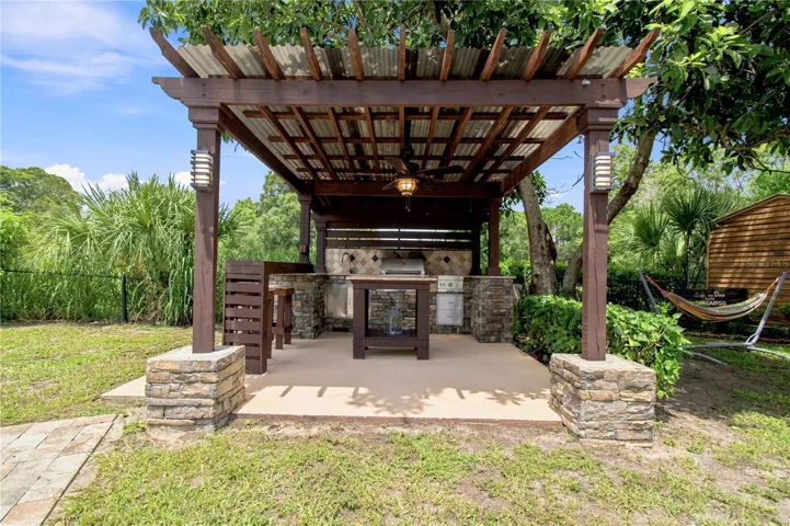 an open-air poolside BBQ cabana