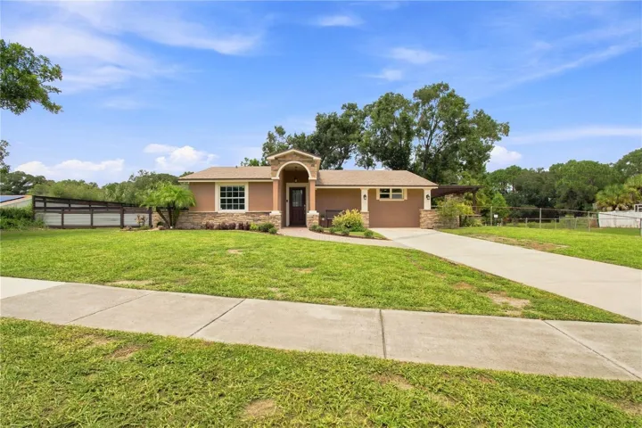 Front View warm color stone decor blends for a cohesive upgrade look, with Portico and Porch, paved walkway to complete the beautiful curb appeal.