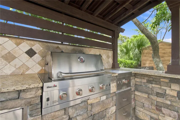 an open-air poolside BBQ cabana