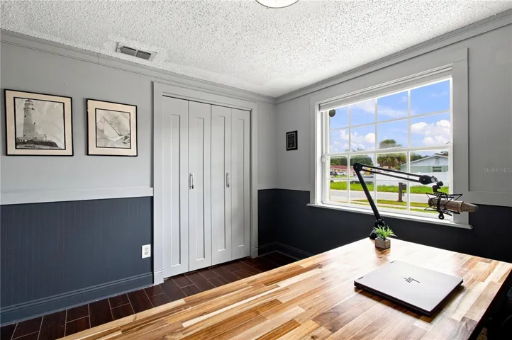 Bedroom #2 Wainscotting and beadboard wood wall designs elevates this room