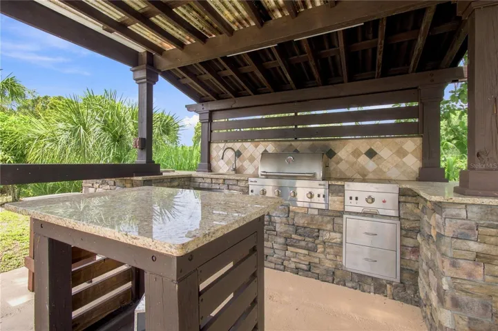 an open-air poolside BBQ cabana