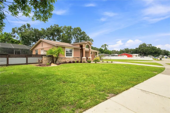 Front View warm color stone decor blends for a cohesive upgrade look, with Portico and Porch, paved walkway to complete the beautiful curb appeal.