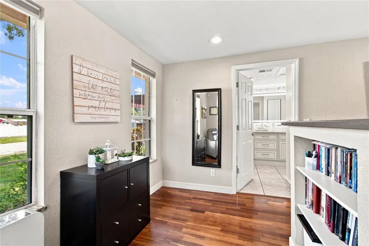 Huge Primary Bedroom with separate reading area and built in bookshelves