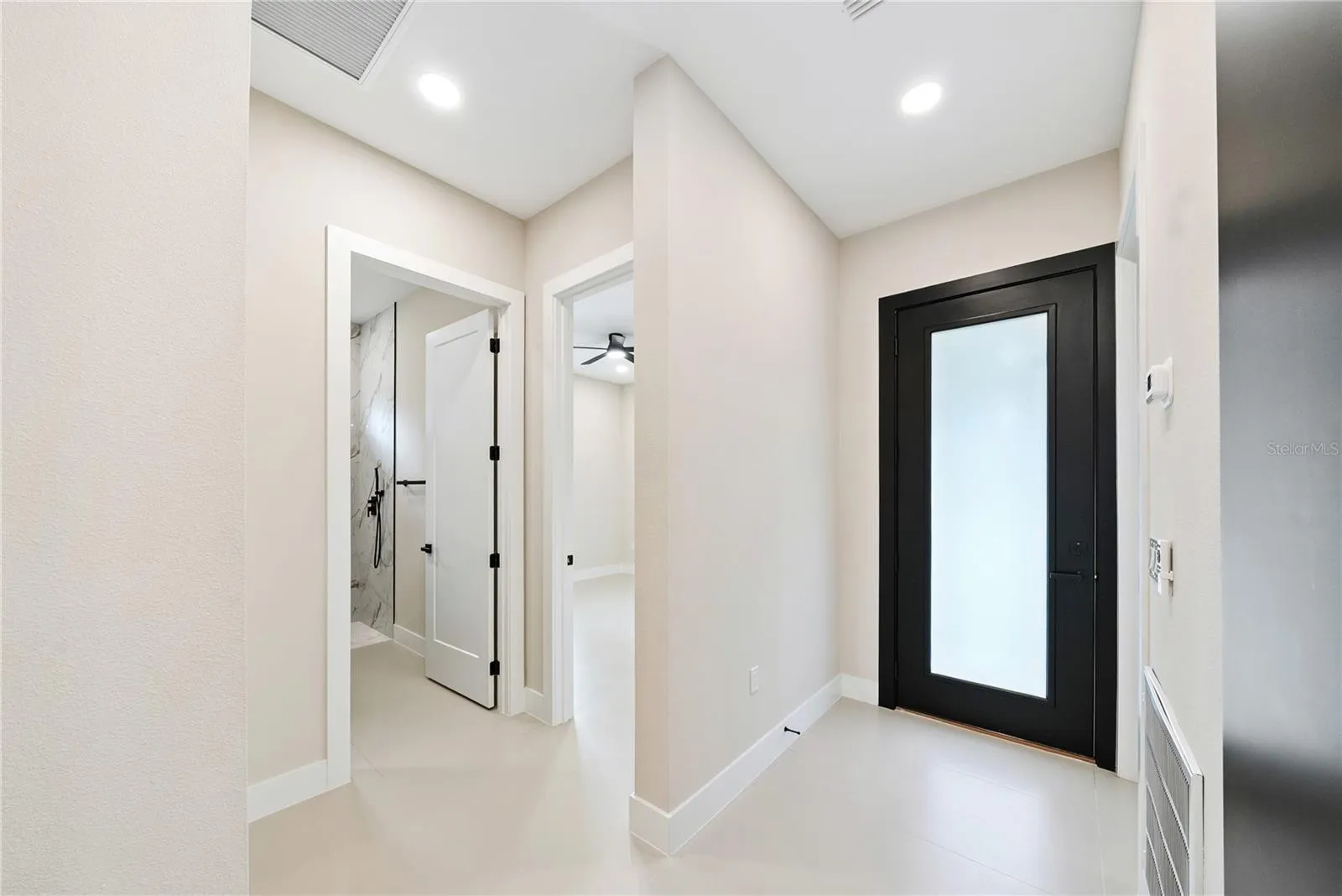 Modern hallway, glass door to lanai