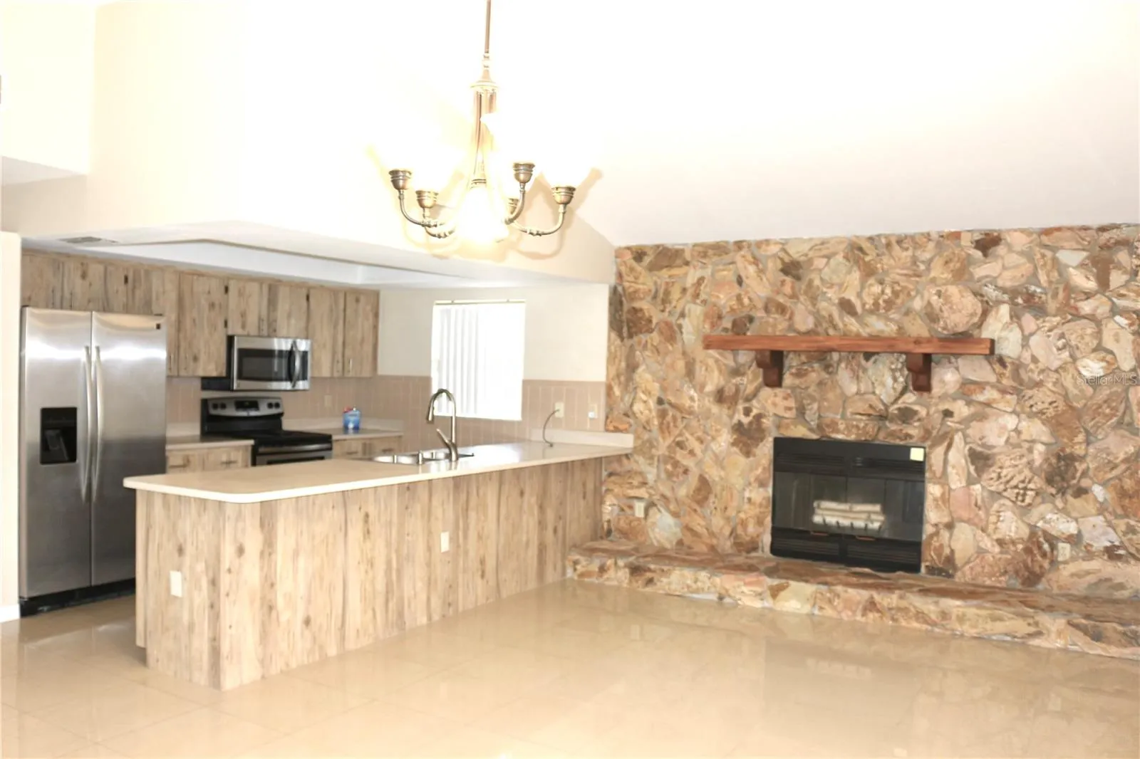 Wood burning fireplace in the family room