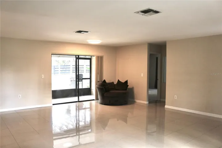 Open the sliding doors from the living room to a screened lanai