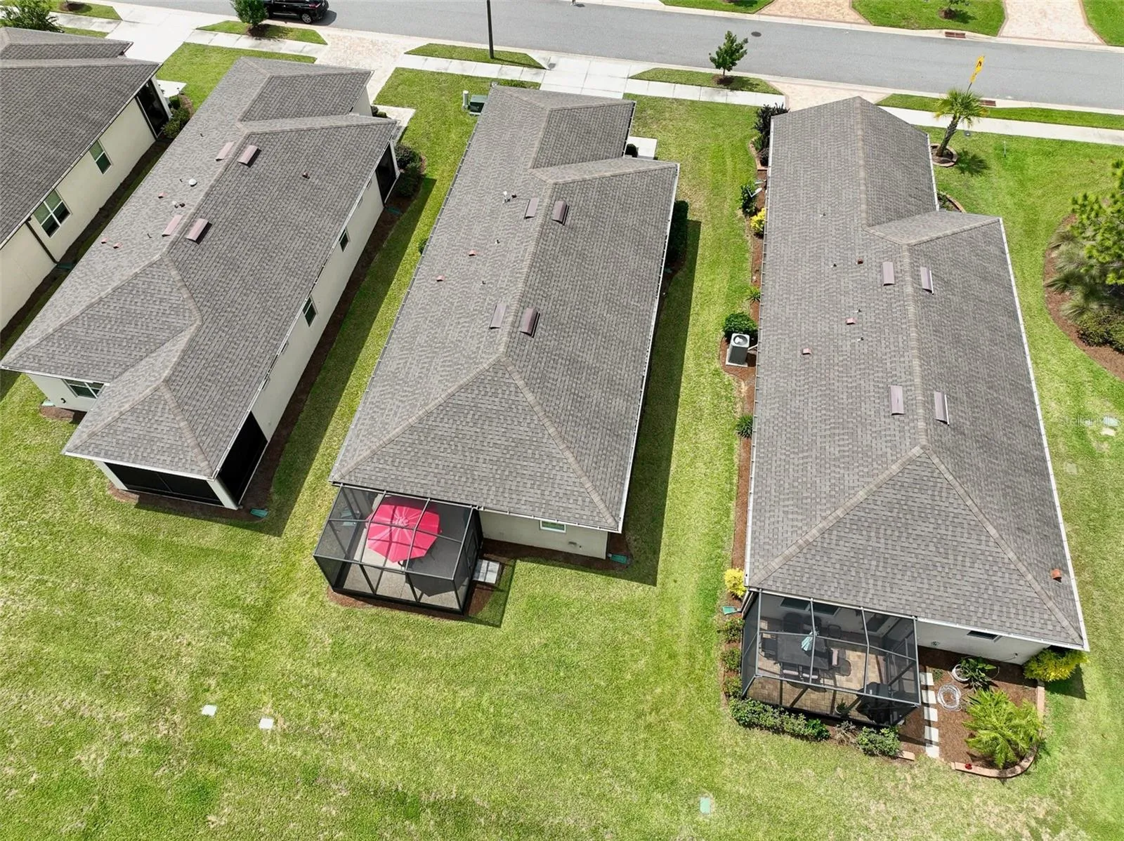 Aerial view from rear of home (red umbrella visible in screened cage)
