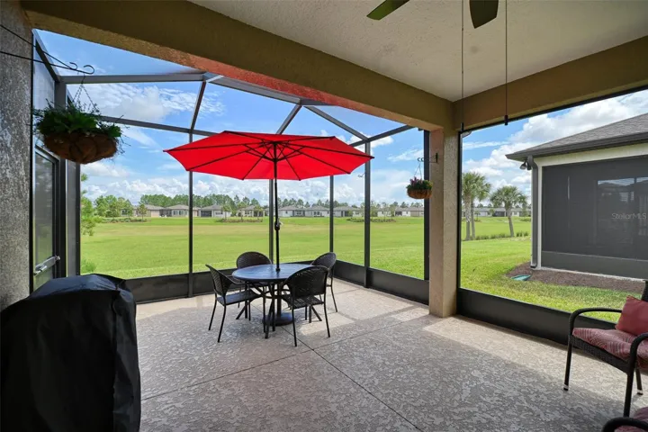 Covered, screened lanai w/additional screen cage overlooking greenbelt dry retention area