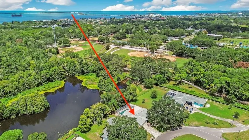 Welcome to 1788 Patricia Ave Dunedin and your lakefront sanctuary with the beach being this far away