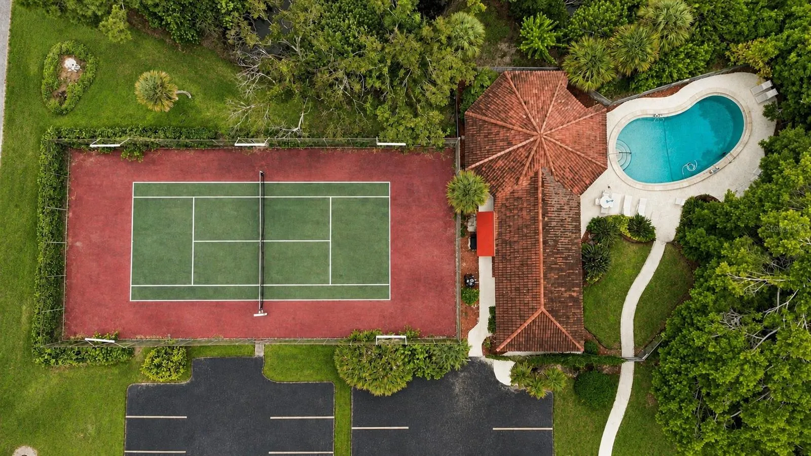 Aerial view of Tennis Court, Pool, and Clubhouse