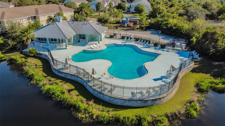 Outstanding pool resort style community with lake views, playground, club house and fitness center!