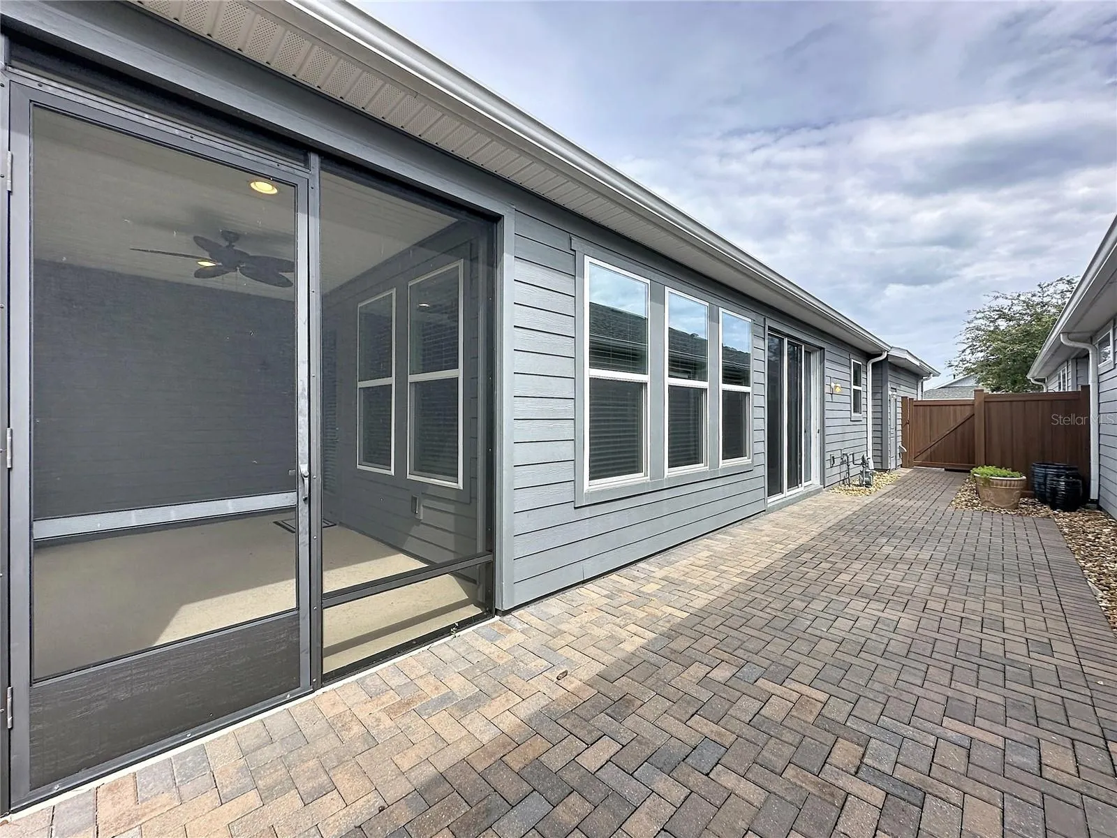 Spacious side courtyard brings the outdoors in and is the perfect area for entertaining